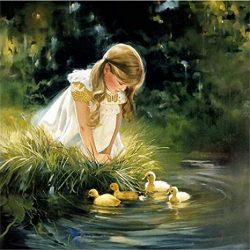 little child watching ducklings by pond